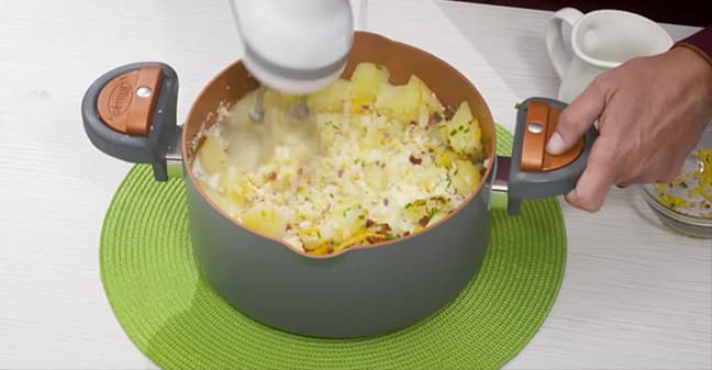 Mixing potatoes with hand mixer
